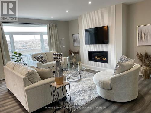 7 Nipigon Street, Kawartha Lakes (Verulam), ON - Indoor Photo Showing Living Room With Fireplace