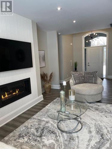 7 Nipigon Street, Kawartha Lakes (Verulam), ON - Indoor Photo Showing Living Room With Fireplace