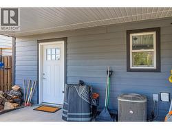 Covered lower patio, entrance into the storage area - 
