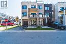View of front of home featuring a balcony, stucco siding, asphalt driveway, and an attached garage - 1121 Cooke Boulevard Unit# 13, Burlington, ON  - Outdoor With Balcony With Facade 