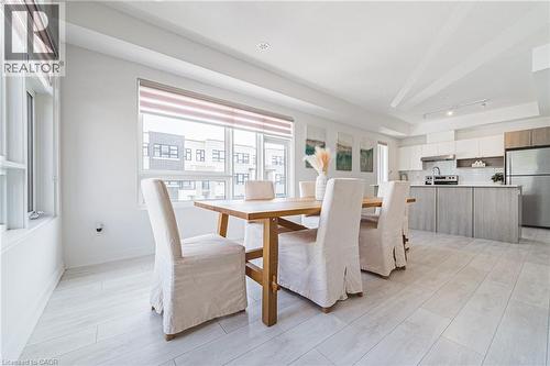 Dining space featuring light wood-type flooring and baseboards - 1121 Cooke Boulevard Unit# 13, Burlington, ON - Indoor