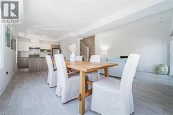 Dining area featuring stairs and light wood finished floors - 