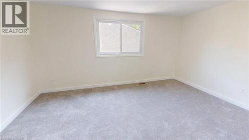 Empty room with light colored carpet and baseboards - 280 Thaler Avenue Unit# 14, Kitchener, ON - Indoor Photo Showing Other Room