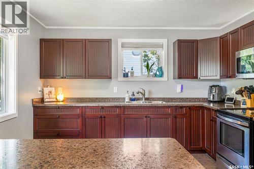 813 98Th Avenue, Tisdale, SK - Indoor Photo Showing Kitchen With Double Sink
