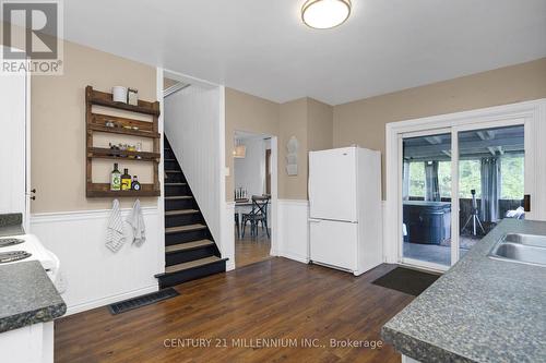 Access to 3 season sunroom - 1551 Queen Street E, Caledon, ON - Indoor Photo Showing Kitchen With Double Sink