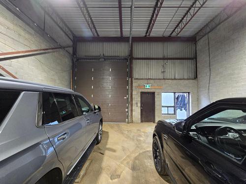 Warehouse - 1537 Desserte Nord Laval (A-440) O., Laval (Chomedey), QC - Indoor Photo Showing Garage