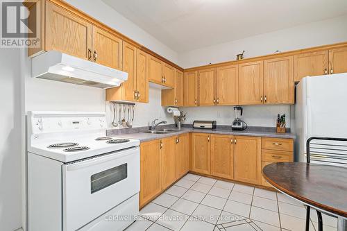 27 Tisdale Street N, Hamilton, ON - Indoor Photo Showing Kitchen With Double Sink