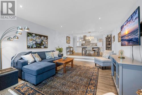 OPEN CONCEPT KITCHEN, DINING & SUNKEN LIVING ROOM! - 105 - 20 Speers Road, Oakville (Co Central), ON - Indoor Photo Showing Living Room