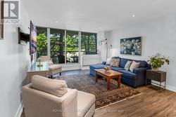 W/O TO LARGE PRIVATE BALCONY FROM LIVING RM. - 