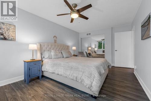 DOUBLE MIRRORED CLOSET & CEILING FAN - 105 - 20 Speers Road, Oakville (Co Central), ON - Indoor Photo Showing Bedroom