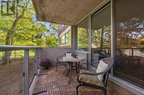 ELEVATED BALCONY WITH NEW GLASS RAILING & DOORS - 105 - 20 Speers Road, Oakville (Co Central), ON - Outdoor With Balcony With Deck Patio Veranda With Exterior