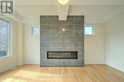 gas fireplace in family room - 61 Golden Meadows Drive, Otonabee-South Monaghan, ON - Indoor Photo Showing Living Room With Fireplace