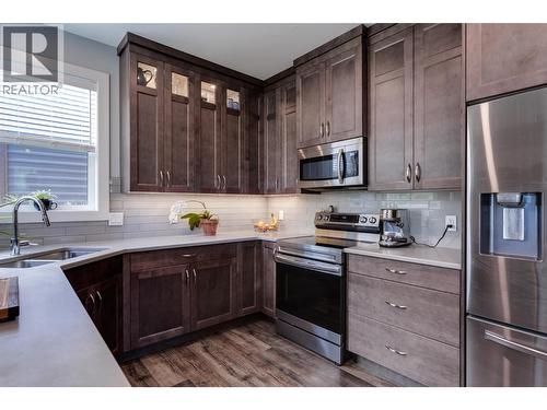 1257 And 1259 Rio Drive, Kelowna, BC - Indoor Photo Showing Kitchen With Double Sink