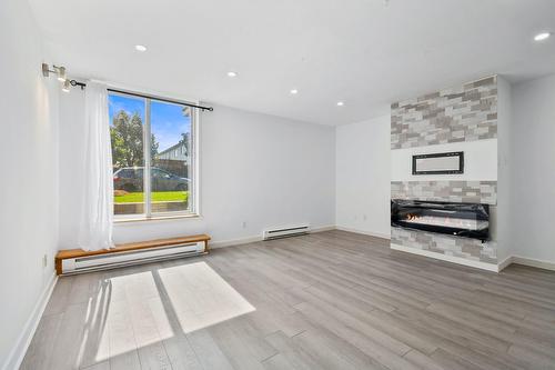 Salon - 2-625 Rue De Chevillon, Laval (Chomedey), QC - Indoor With Fireplace