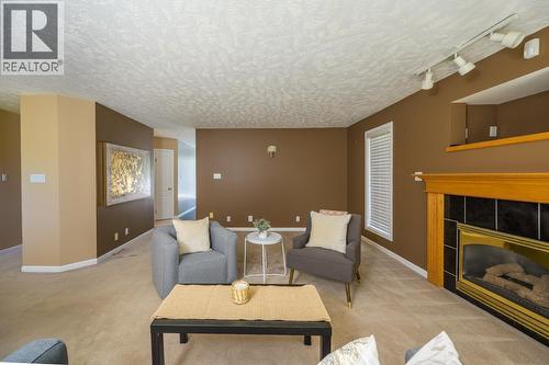 3172 Seton Place, Prince George, BC - Indoor Photo Showing Living Room With Fireplace
