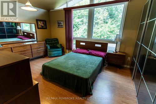 Primary bedroom with lake views &  vaulted ceiling - 2 Cowley Street, Whitewater Region, ON - Indoor Photo Showing Bedroom
