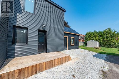 Side deck. Attached and detached storage units. - 47 Bonnechere Street N, Renfrew, ON - Outdoor With Exterior