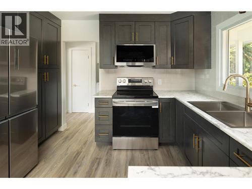 1284 Mcbride Road, Kelowna, BC - Indoor Photo Showing Kitchen With Double Sink With Upgraded Kitchen
