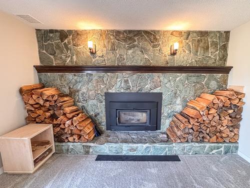 3025 9Th Street, Cranbrook, BC - Indoor Photo Showing Living Room With Fireplace