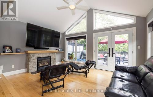 Family Room Large Windows and W/O to Deck - 2183 Sandringham Drive, Burlington, ON - Indoor Photo Showing Living Room With Fireplace