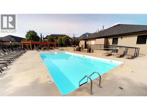 500 Bighorn Boulevard Unit# 513, Radium Hot Springs, BC - Outdoor With In Ground Pool With Deck Patio Veranda