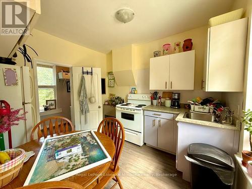 Inviting and bright eat-in kitchen in upper unit. - 4 Duncan Street E, Huntsville (Chaffey), ON - Indoor Photo Showing Kitchen
