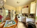 Inviting and bright eat-in kitchen in upper unit. - 4 Duncan Street E, Huntsville (Chaffey), ON  - Indoor Photo Showing Kitchen 