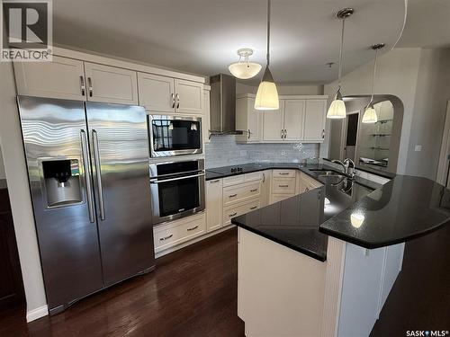 405 75 Souris Avenue, Weyburn, SK - Indoor Photo Showing Kitchen With Double Sink With Upgraded Kitchen