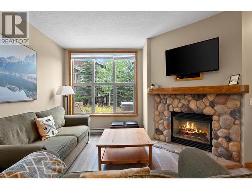 6005 Valley Drive Unit# 68, Sun Peaks, BC - Indoor Photo Showing Living Room With Fireplace