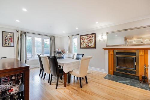 Salle à manger - 388 Rue Du Colibri, Rosemère, QC - Indoor Photo Showing Dining Room With Fireplace