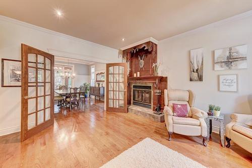 Salon - 122 Rue Jean-De Ronceray, Carignan, QC - Indoor Photo Showing Living Room With Fireplace