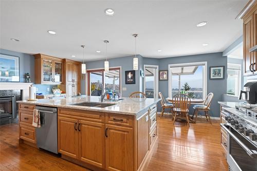 3285 Sundance Drive, West Kelowna, BC - Indoor Photo Showing Kitchen With Fireplace With Double Sink