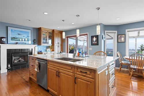 3285 Sundance Drive, West Kelowna, BC - Indoor Photo Showing Kitchen With Fireplace With Double Sink