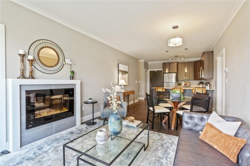 101-1145 Sikorsky Rd, Langford, BC - Indoor Photo Showing Living Room With Fireplace