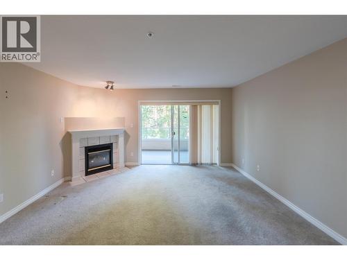 2245 Atkinson Street Unit# 205, Penticton, BC - Indoor Photo Showing Living Room With Fireplace