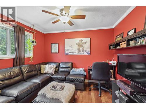 DEN - Hardwood floors & ceiling fan! - 3404 Alexis Park Drive, Vernon, BC - Indoor Photo Showing Living Room