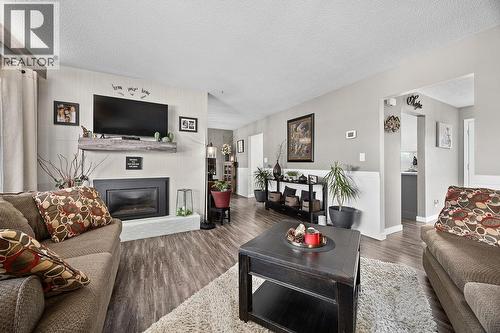 11701 Coldstream Creek Road, Coldstream, BC - Indoor Photo Showing Living Room With Fireplace