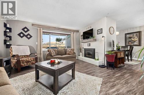 11701 Coldstream Creek Road, Coldstream, BC - Indoor Photo Showing Living Room With Fireplace
