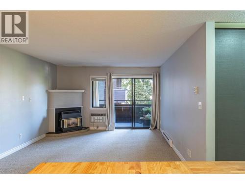 1801 32 Street Unit# 203, Vernon, BC - Indoor Photo Showing Other Room With Fireplace