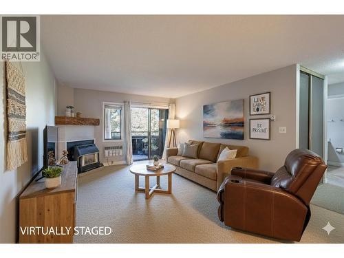 1801 32 Street Unit# 203, Vernon, BC - Indoor Photo Showing Living Room With Fireplace