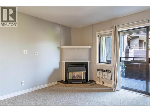 1801 32 Street Unit# 203, Vernon, BC - Indoor Photo Showing Other Room With Fireplace