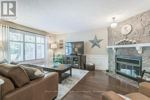 Main floor Family Room - 2139 Brays Lane, Oakville (Ga Glen Abbey), ON - Indoor Photo Showing Living Room With Fireplace