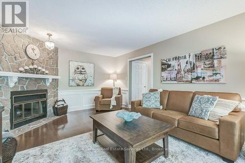 Family Room with wood burning fireplace - 2139 Brays Lane, Oakville (Ga Glen Abbey), ON - Indoor Photo Showing Living Room With Fireplace