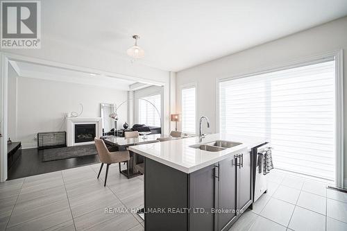 Kitchen - 25 Kentledge Avenue, East Gwillimbury, ON - Indoor Photo Showing Kitchen With Fireplace With Double Sink