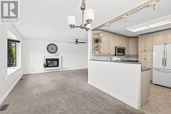 Kitchen is tucked away, making hosting a breeze! - 