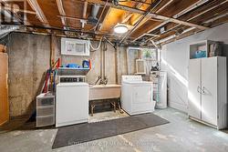 Unfinished laundry room with ample storage - 