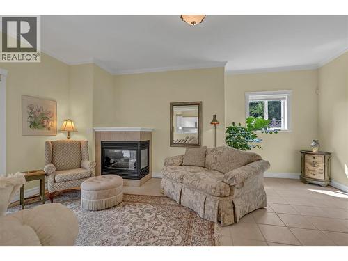 1078 Burnaby Avenue Unit# 105, Penticton, BC - Indoor Photo Showing Living Room With Fireplace