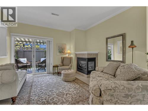 1078 Burnaby Avenue Unit# 105, Penticton, BC - Indoor Photo Showing Living Room With Fireplace