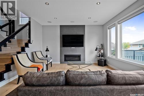 4311 Sandpiper Crescent E, Regina, SK - Indoor Photo Showing Living Room With Fireplace