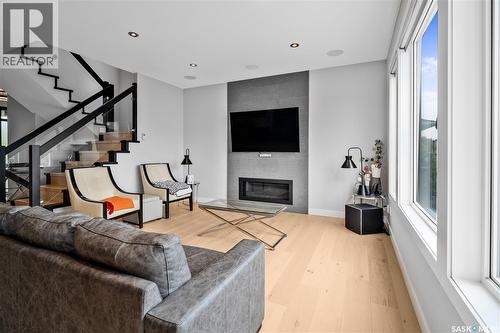 4311 Sandpiper Crescent E, Regina, SK - Indoor Photo Showing Living Room With Fireplace